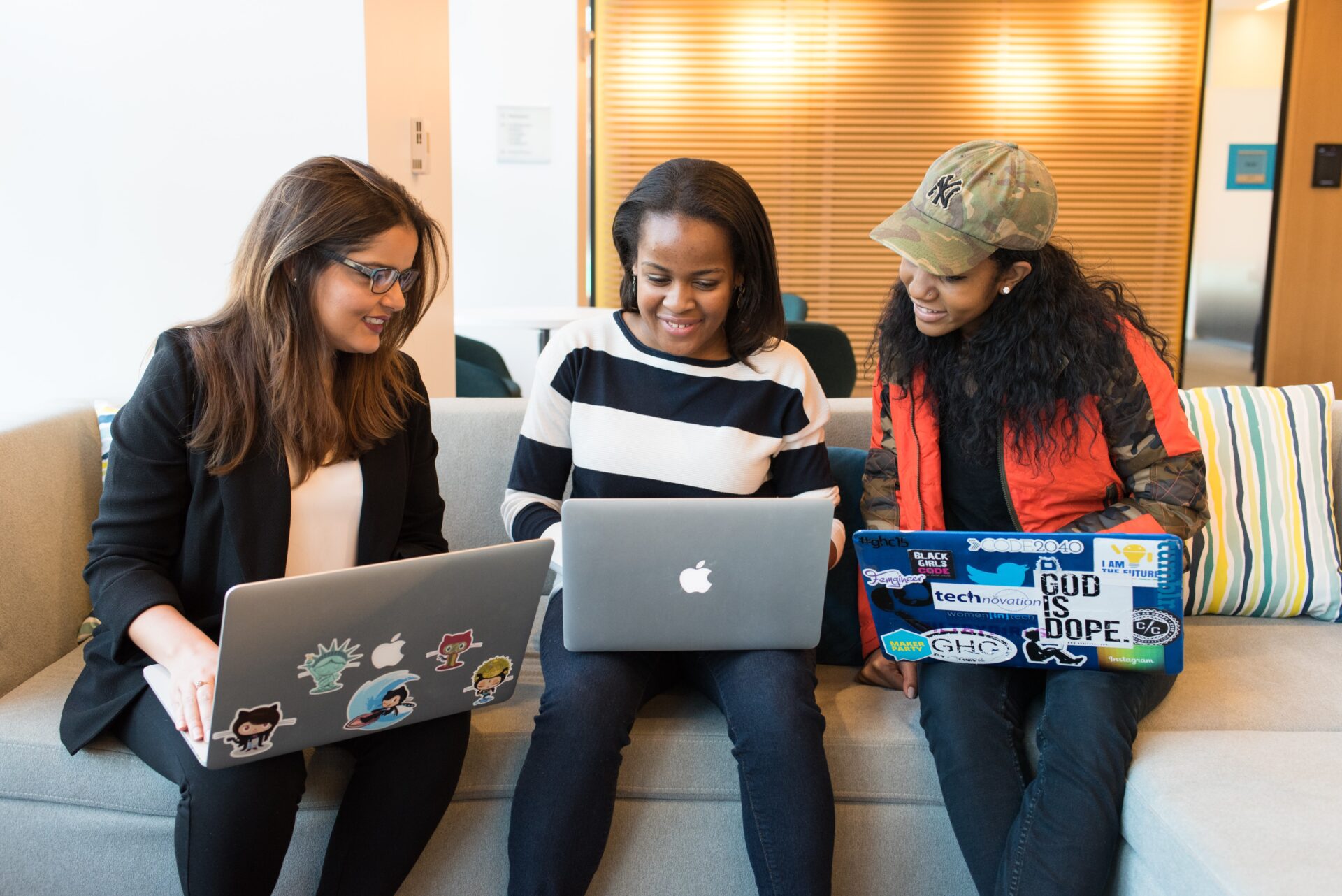 christina-wocintechchat-com-FPQlXQtjkqU-unsplash women sitting on the couch